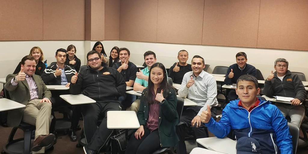 Ryder Todd Smith with students thumbs up
