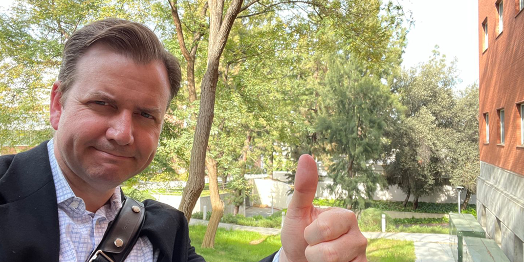 Ryder Todd Smith, Tripepi Smith founder, thumbs up near USC dorms